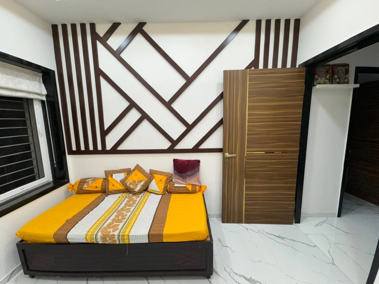 Bedroom batten feature wall with the wardrobe door standing open