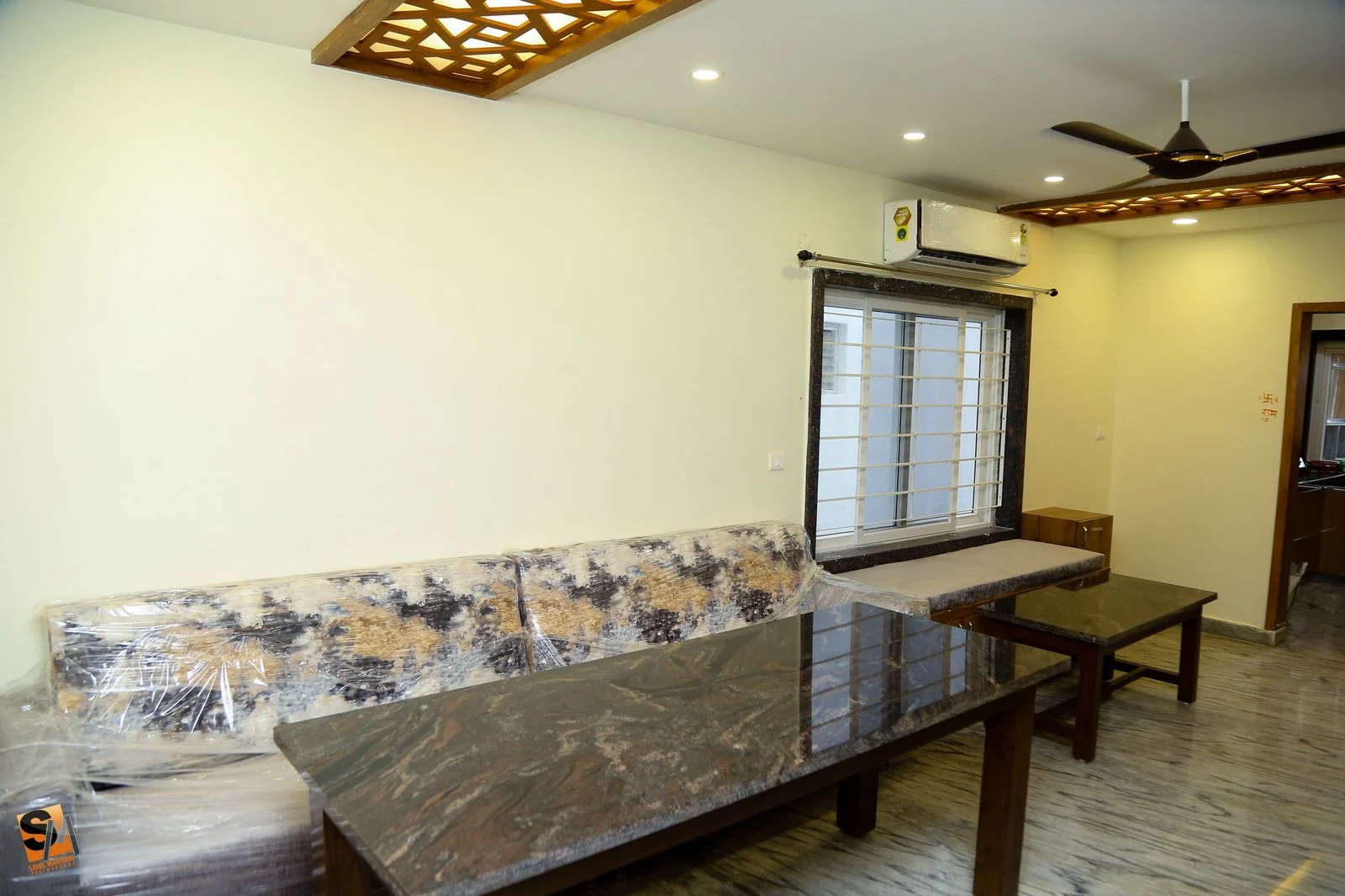 Dining area with a granite table and bench seating along the window