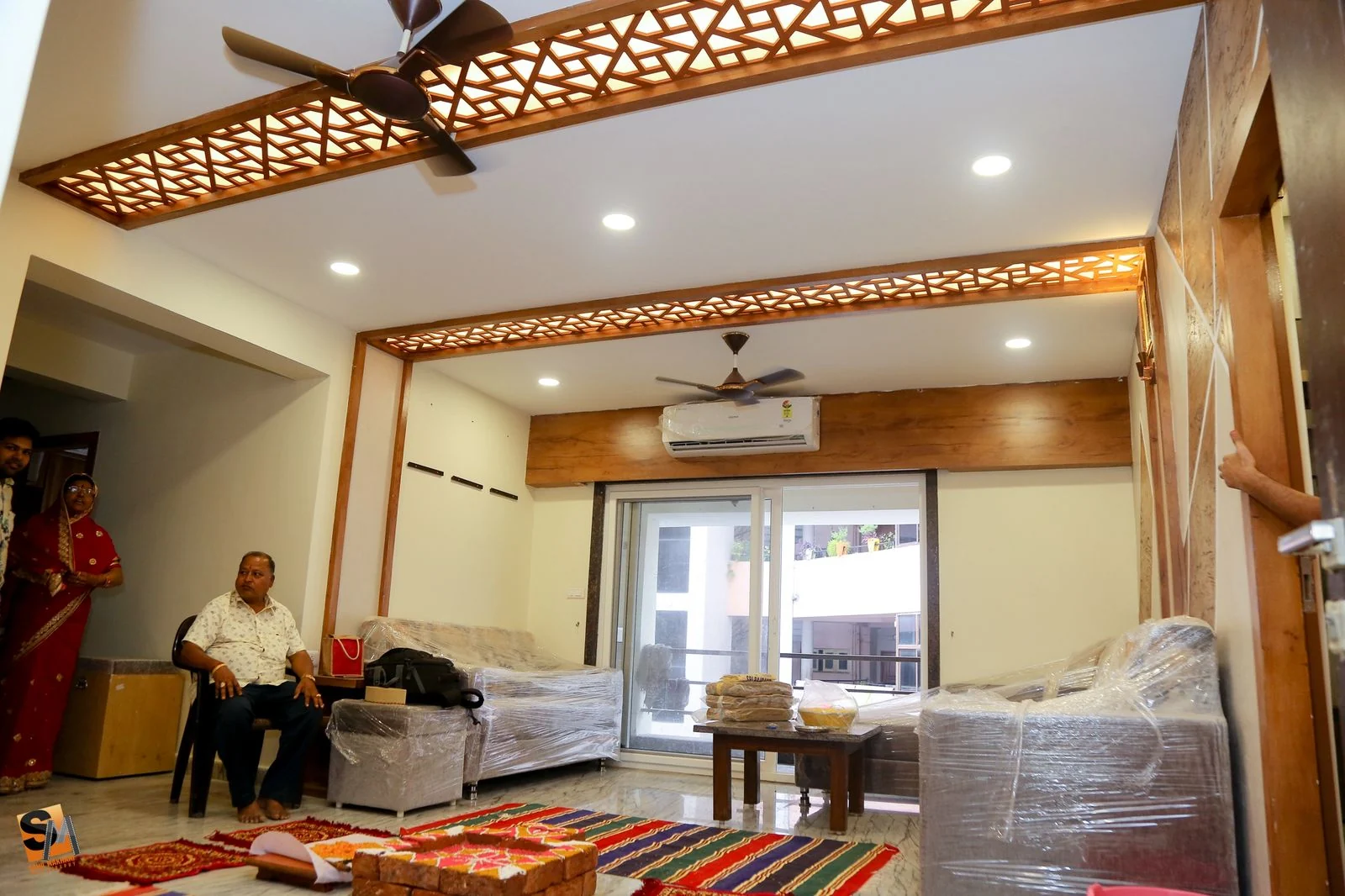 Wide view of the living room fretwork ceiling beams on handover day